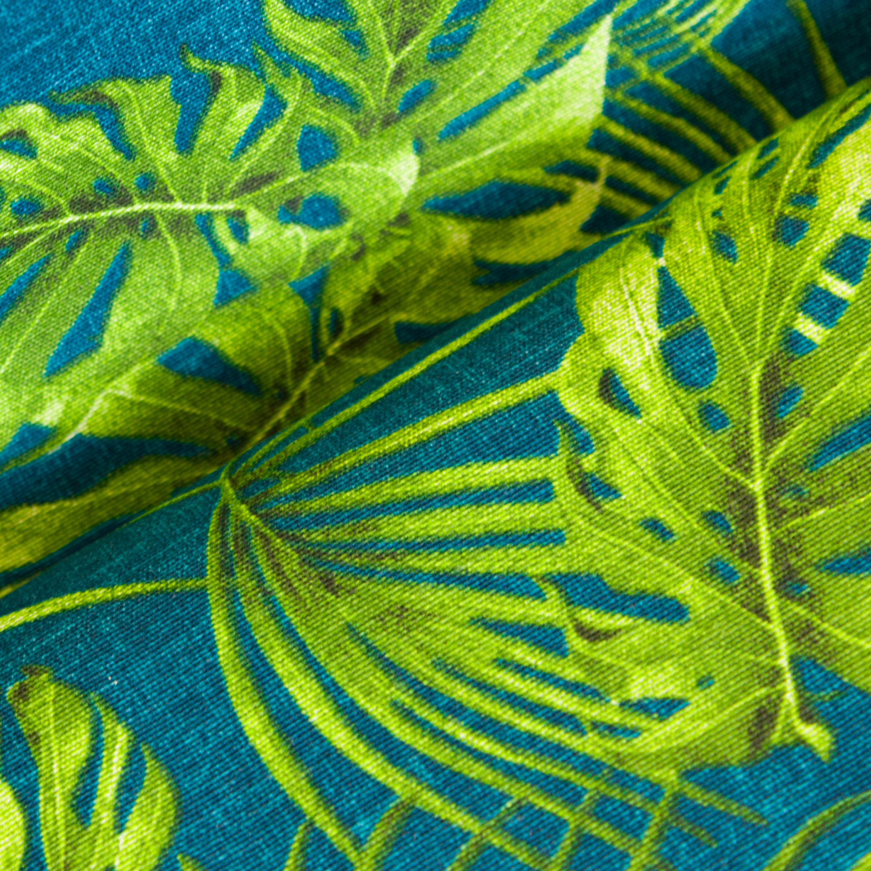 Canvas blauw met groene bladeren